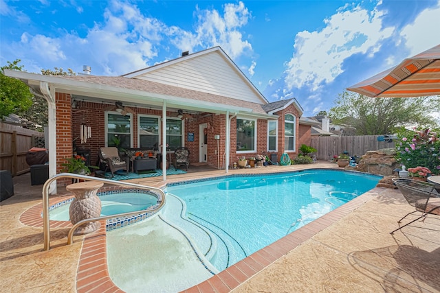 view of swimming pool featuring a fenced backyard, a ceiling fan, a patio, and an outdoor living space