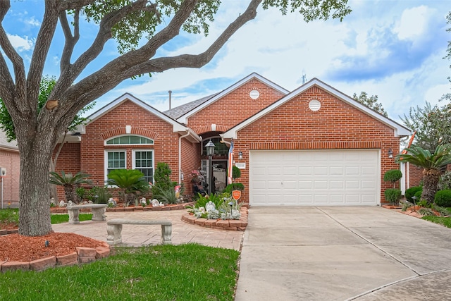 ranch-style house with concrete driveway, brick siding, and an attached garage