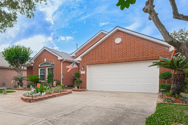 ranch-style home featuring a garage, driveway, and brick siding