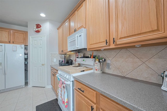 kitchen with decorative backsplash, white appliances, recessed lighting, light countertops, and light tile patterned floors
