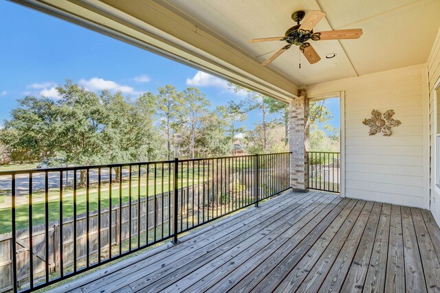 wooden terrace with a ceiling fan