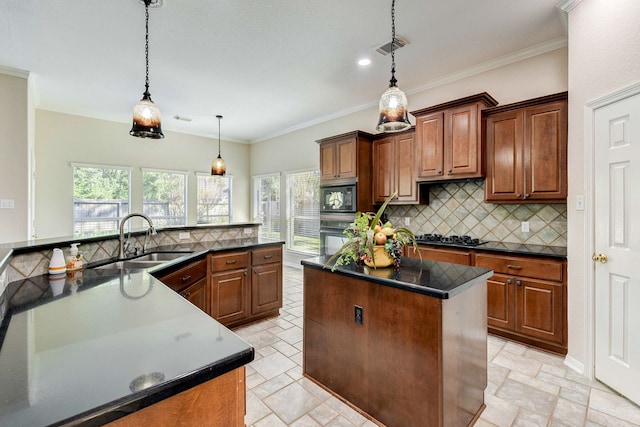 kitchen featuring a center island, a sink, tasteful backsplash, dark countertops, and black appliances