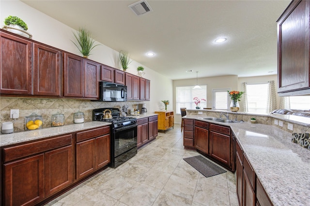 kitchen featuring recessed lighting, backsplash, visible vents, a sink, and black appliances