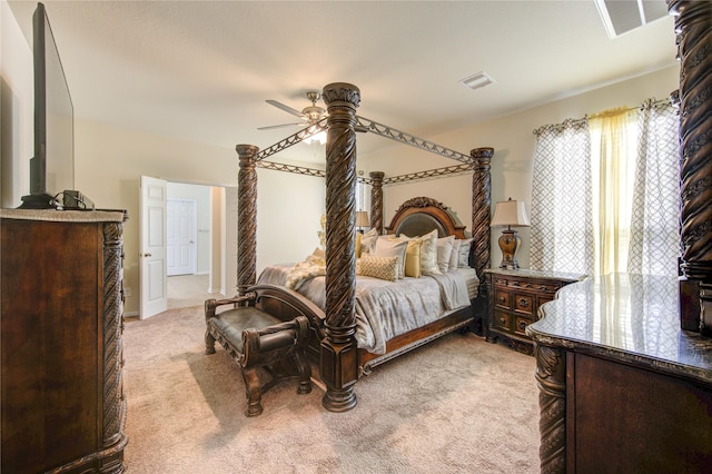 bedroom featuring visible vents, a ceiling fan, and light carpet