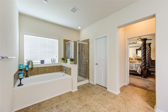 ensuite bathroom featuring a bath, visible vents, connected bathroom, and a shower stall