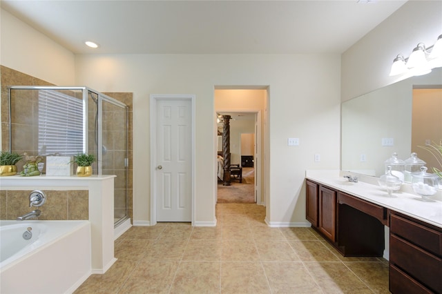 ensuite bathroom with ensuite bathroom, a stall shower, a bath, vanity, and tile patterned flooring