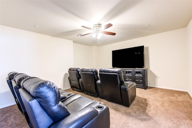 cinema featuring visible vents, light carpet, a ceiling fan, and baseboards