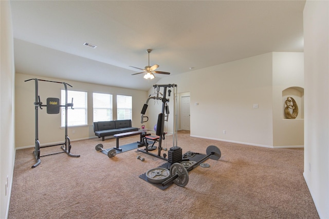workout area featuring vaulted ceiling, ceiling fan, carpet floors, baseboards, and visible vents