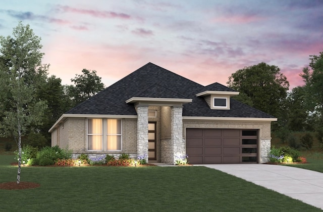 view of front of home featuring a lawn, an attached garage, driveway, and stone siding