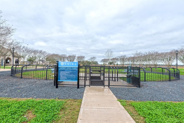 view of property's community featuring a gate and fence
