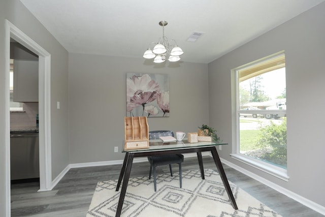 10654 Mayfield Rd, Houston, TX 77043 - office featuring wood finished floors, visible vents, plenty of natural light, and an inviting chandelier