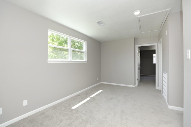 10654 Mayfield Rd, Houston, TX 77043 - unfurnished room featuring attic access, visible vents, baseboards, and light carpet