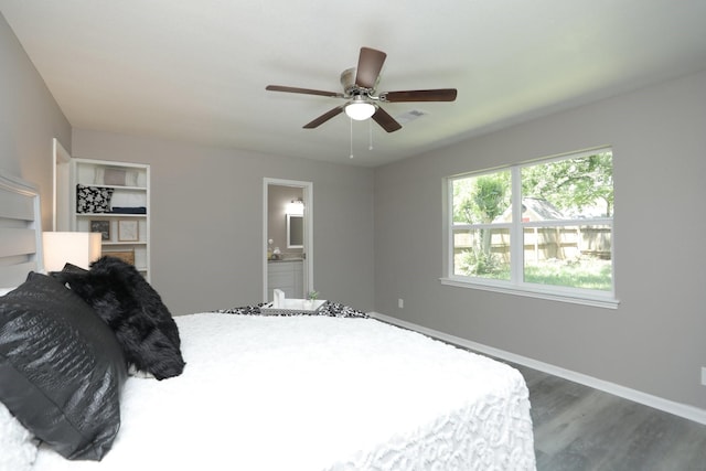 10654 Mayfield Rd, Houston, TX 77043 - bedroom featuring wood finished floors, visible vents, a ceiling fan, connected bathroom, and baseboards