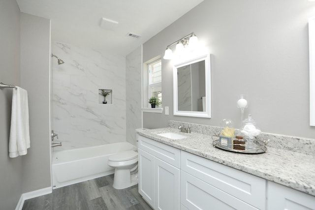 10654 Mayfield Rd, Houston, TX 77043 - full bath with  shower combination, toilet, visible vents, wood finished floors, and vanity