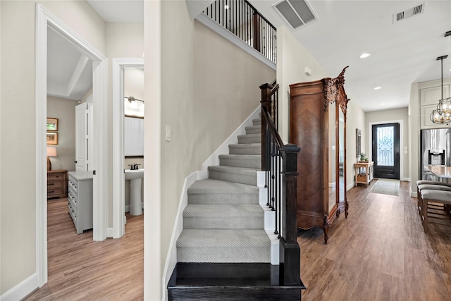 3105 Magnolia Knoll Ln, Houston, TX 77080 - stairway featuring baseboards, recessed lighting, visible vents, and wood finished floors