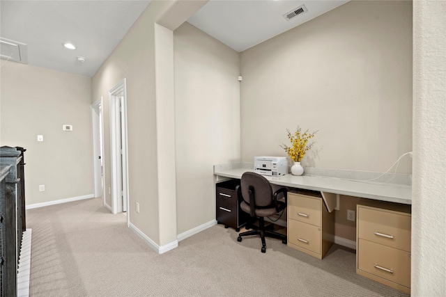 office with visible vents, attic access, baseboards, and light carpet