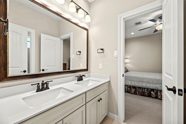 bathroom featuring a sink, ceiling fan, double vanity, and visible vents