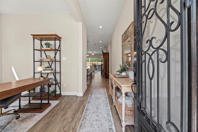 entrance foyer with baseboards, recessed lighting, and wood finished floors