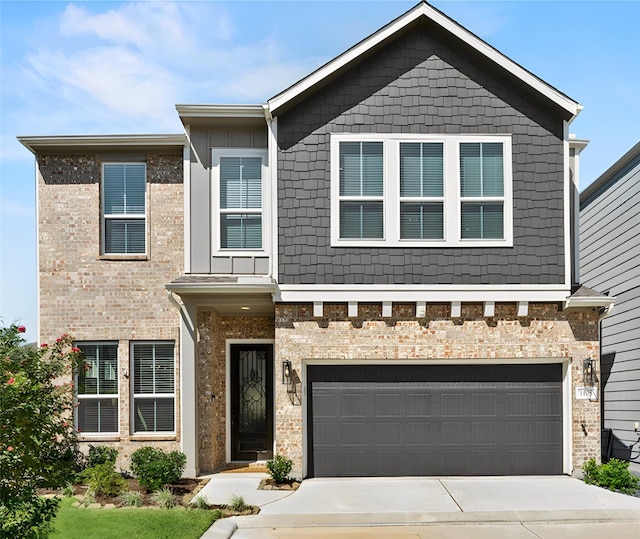 view of front of house with concrete driveway and a garage