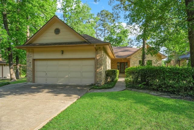 12 Cherry Hill Dr, Conroe, TX 77304 - view of front facade featuring brick siding, an attached garage, driveway, and a front lawn
