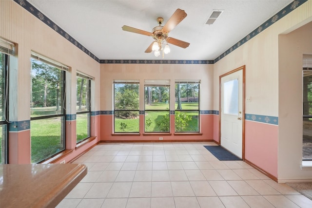 12 Cherry Hill Dr, Conroe, TX 77304 - unfurnished room with wallpapered walls, plenty of natural light, baseboards, and a ceiling fan