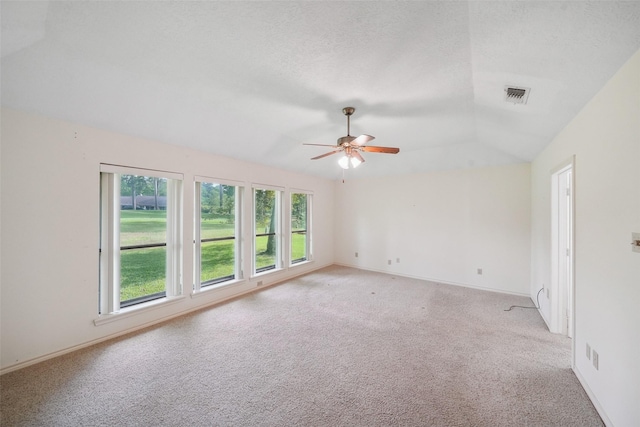 12 Cherry Hill Dr, Conroe, TX 77304 - spare room with light colored carpet, a ceiling fan, vaulted ceiling, and baseboards