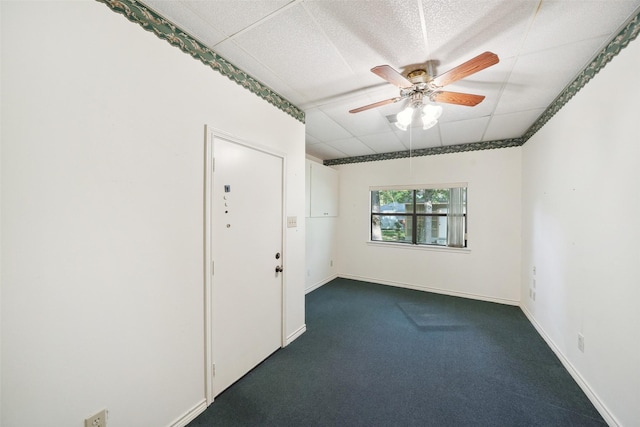 12 Cherry Hill Dr, Conroe, TX 77304 - spare room featuring ceiling fan, dark colored carpet, and baseboards