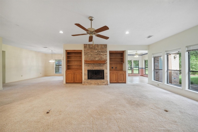 12 Cherry Hill Dr, Conroe, TX 77304 - unfurnished living room with ceiling fan, a fireplace, light carpet, recessed lighting, and baseboards