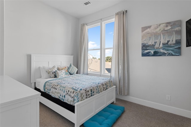 bedroom featuring visible vents, baseboards, and carpet flooring