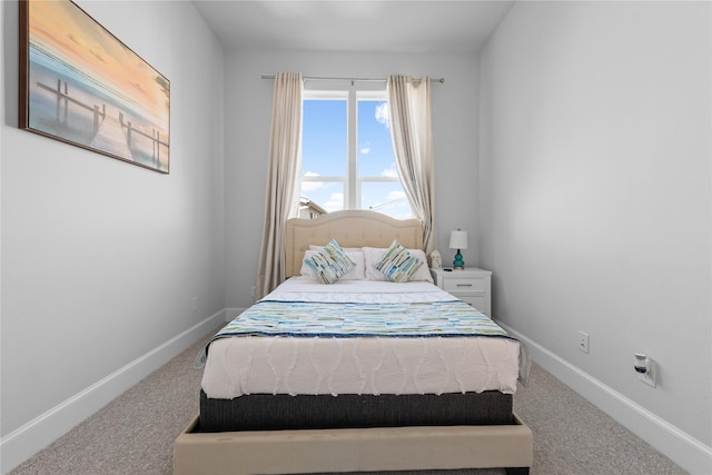 carpeted bedroom with baseboards