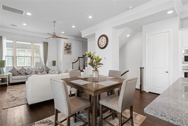 dining room with crown molding, stairs, visible vents, and recessed lighting