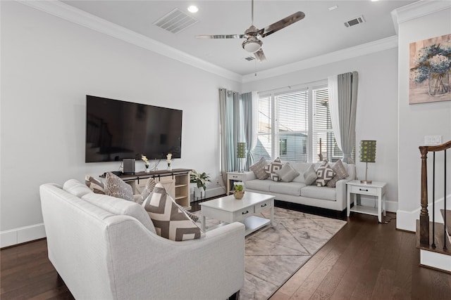 living room featuring hardwood / wood-style flooring, ceiling fan, baseboards, and visible vents