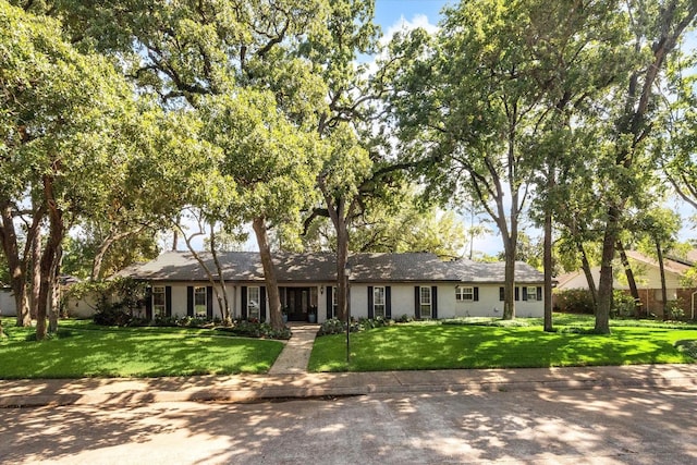 ranch-style house with a front lawn