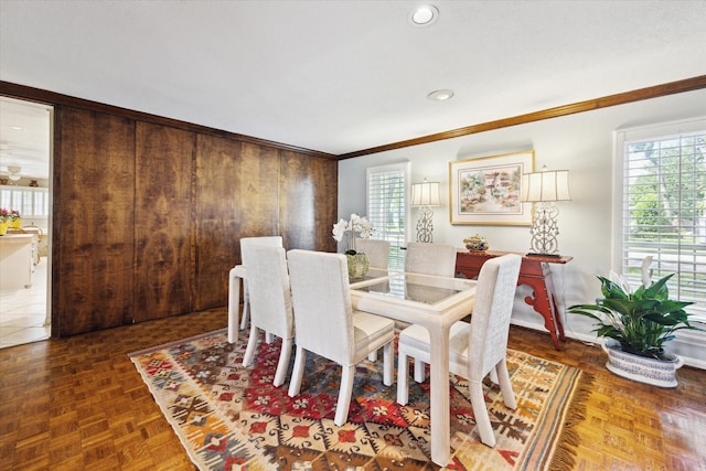 dining space with recessed lighting, ornamental molding, and baseboards