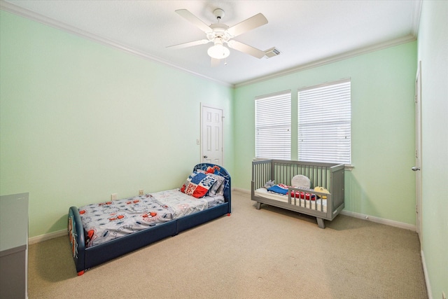 bedroom with baseboards, ornamental molding, and carpet flooring