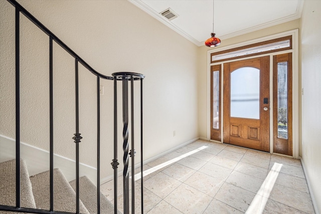 foyer entrance with baseboards, crown molding, visible vents, and light tile patterned floors