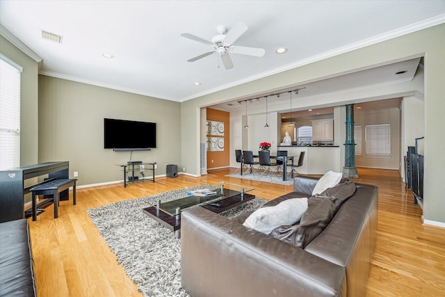 living area featuring a ceiling fan, visible vents, recessed lighting, and light wood-style floors
