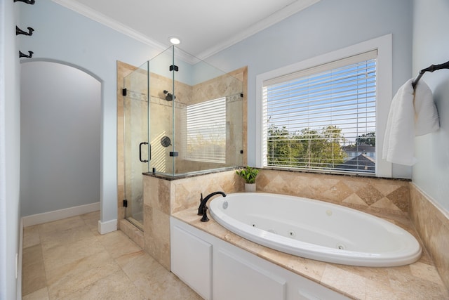 bathroom with a shower stall, crown molding, and a jetted tub