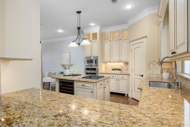 kitchen with a sink, beverage cooler, stainless steel appliances, ornamental molding, and light stone countertops