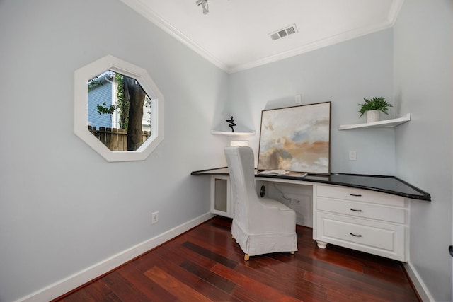 unfurnished office with visible vents, dark wood-type flooring, ornamental molding, and built in study area