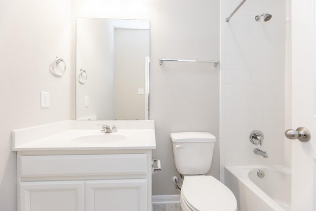 full bath with baseboards, toilet, vanity, and shower / tub combination
