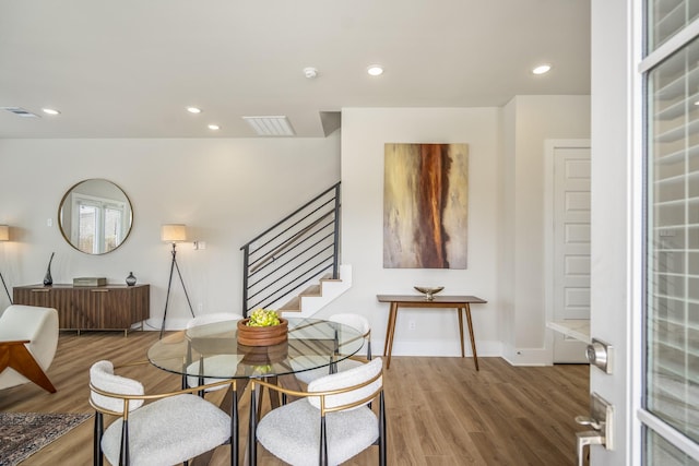 8411 Pech Landing Dr, Houston, TX 77055 - dining area featuring stairway, wood finished floors, recessed lighting, and baseboards