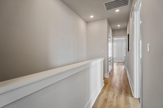 8411 Pech Landing Dr, Houston, TX 77055 - hallway with light wood finished floors, recessed lighting, and baseboards