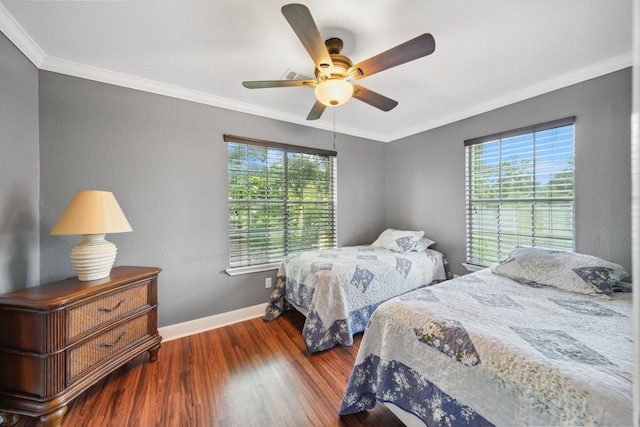 11642 Borderwood Dr, Houston, TX 77013 - bedroom with multiple windows, wood finished floors, ornamental molding, baseboards, and a ceiling fan