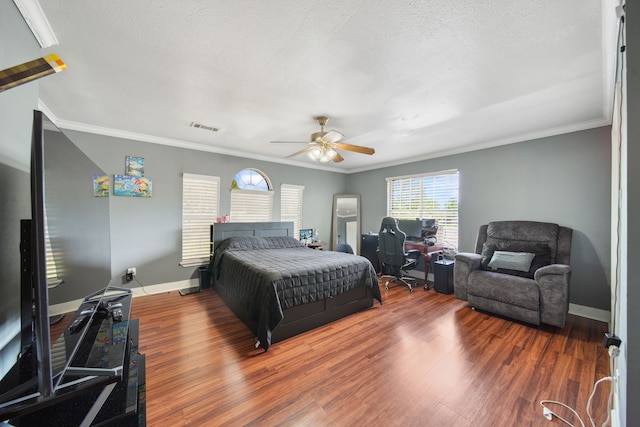 11642 Borderwood Dr, Houston, TX 77013 - bedroom featuring ornamental molding, wood finished floors, baseboards, a ceiling fan, and a textured ceiling