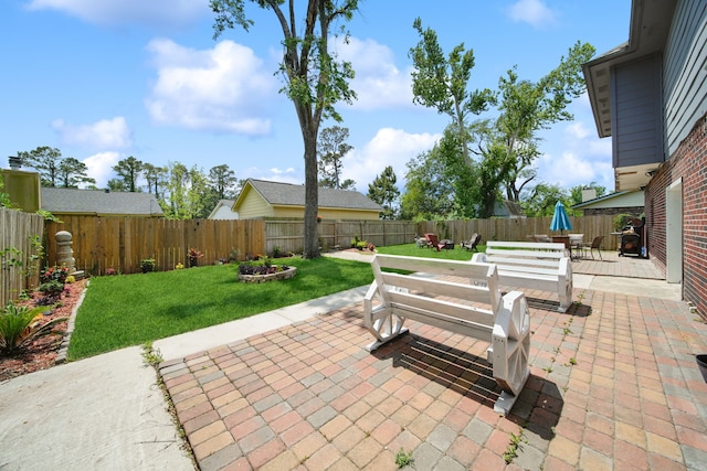 view of patio with a fenced backyard and outdoor dining area