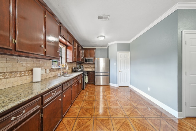 kitchen featuring stainless steel appliances, a sink, tasteful backsplash, baseboards, and crown molding