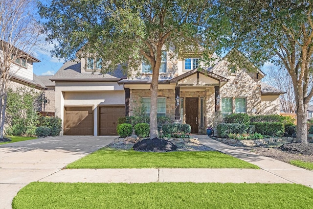 craftsman inspired home with driveway, stone siding, a front lawn, and stucco siding