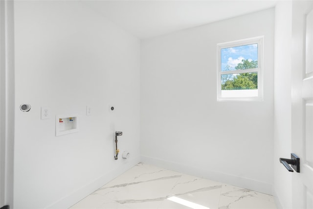 clothes washing area with baseboards, electric dryer hookup, laundry area, and washer hookup