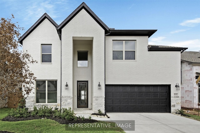 1159 Beals Creek St, Conroe, TX 77304 - view of front of house featuring an attached garage, brick siding, and concrete driveway